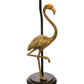 Nærbilde av den dekorative flamingoen til Flamingo bordlampe med lampefot formet som en flamingo i gull og antikk svart med lampeskjerm i velur med frynser - Aneta belysning