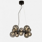 Lysende Molekyl taklampe pendel med 10 sotede glasskupler festet på en rund ramme i sort metall - Aneta belysning